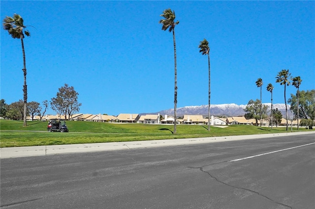 view of road featuring a mountain view and a residential view