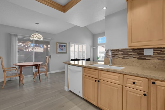 kitchen with a sink, decorative backsplash, white dishwasher, and light brown cabinets