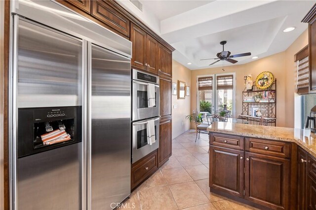 9 Via Haciendas, Rancho Mirage, CA 92270 - kitchen featuring light tile patterned floors, a ceiling fan, recessed lighting, light stone countertops, and stainless steel appliances