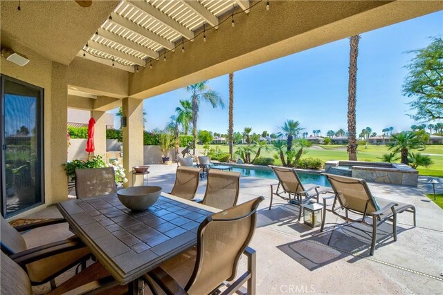 9 Via Haciendas, Rancho Mirage, CA 92270 - view of patio featuring a pergola, a pool with connected hot tub, and outdoor dining area