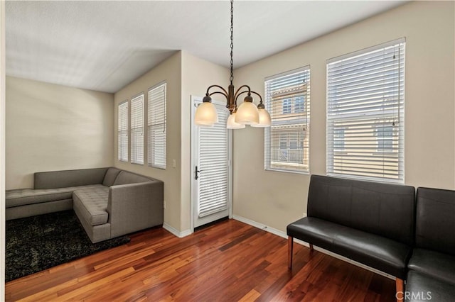 28476 Herrera St, Valencia, CA 91354 - living area featuring a chandelier, wood finished floors, and baseboards