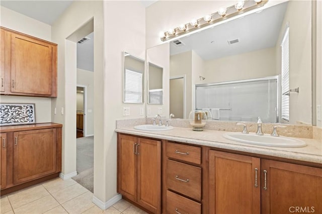28476 Herrera St, Valencia, CA 91354 - bathroom with a shower stall, tile patterned floors, and double vanity