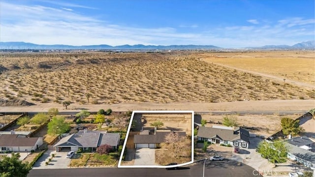 12963 Birch Glen Ct, Victorville, CA 92392 - aerial view of sparsely populated area with property boundaries highlighted, mountains, a desert landscape, and nearby suburban area