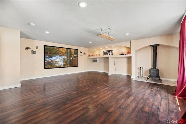 12963 Birch Glen Ct, Victorville, CA 92392 - unfurnished living room featuring wood finished floors, recessed lighting, a wood stove, and baseboards