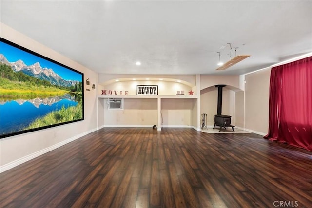 12963 Birch Glen Ct, Victorville, CA 92392 - unfurnished living room with a wood stove, wood finished floors, baseboards, and recessed lighting