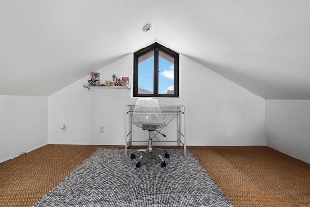 home office featuring lofted ceiling and carpet floors