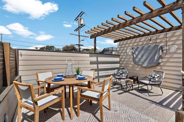 view of patio / terrace with a pergola and outdoor dining space