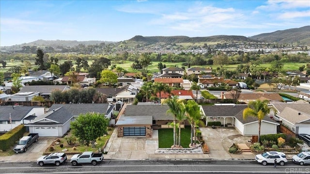 bird's eye view featuring a residential view and a mountain view