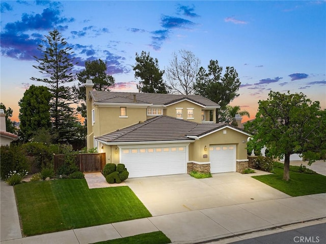 37794 Amber Ln, Murrieta, CA 92562 - traditional-style home with stucco siding, driveway, a tile roof, a garage, and fence