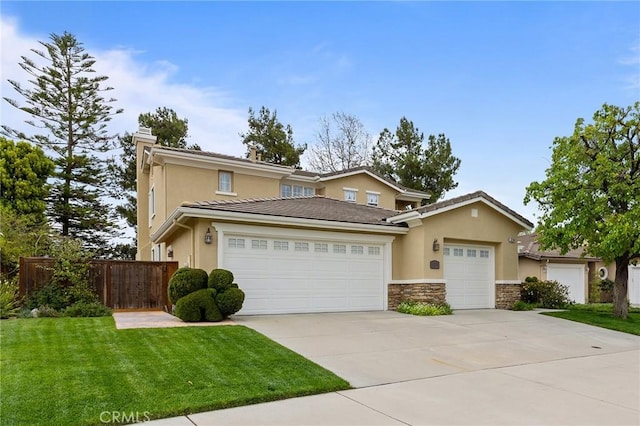 37794 Amber Ln, Murrieta, CA 92562 - traditional home featuring concrete driveway, stucco siding, stone siding, an attached garage, and fence