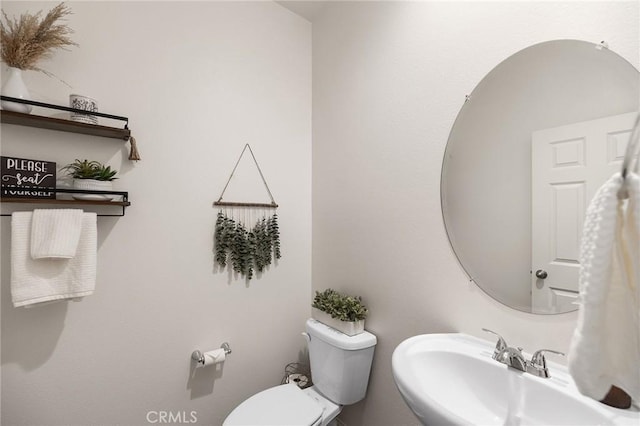 bathroom with a sink and toilet