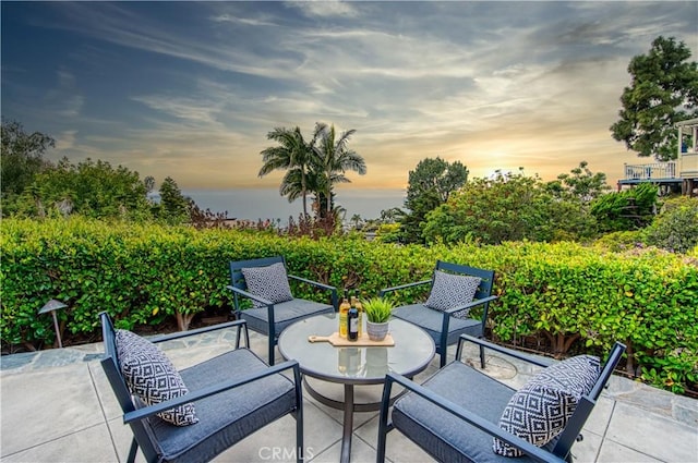 view of patio terrace at dusk