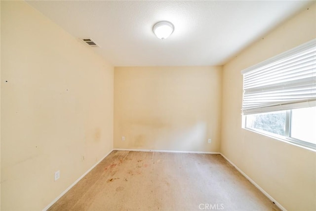 35317 Trevino Trl, Beaumont, CA 92223 - spare room with baseboards, visible vents, and light carpet