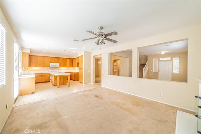35317 Trevino Trl, Beaumont, CA 92223 - unfurnished living room featuring recessed lighting, baseboards, a sink, ceiling fan, and visible vents