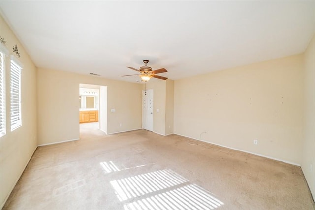 35317 Trevino Trl, Beaumont, CA 92223 - spare room with light colored carpet, visible vents, baseboards, and a ceiling fan