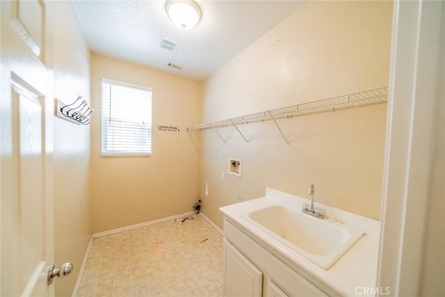 35317 Trevino Trl, Beaumont, CA 92223 - laundry room featuring visible vents, hookup for a washing machine, baseboards, light floors, and a sink