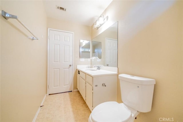 35317 Trevino Trl, Beaumont, CA 92223 - bathroom with baseboards, visible vents, toilet, and vanity