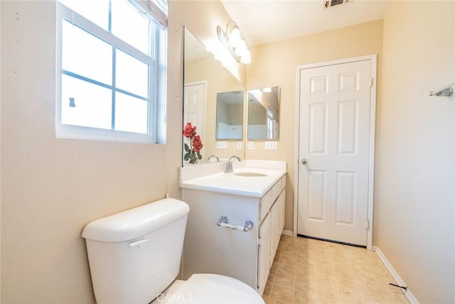 35317 Trevino Trl, Beaumont, CA 92223 - bathroom with toilet, vanity, and baseboards