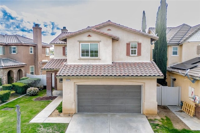 35317 Trevino Trl, Beaumont, CA 92223 - view of front facade with a tile roof, concrete driveway, stucco siding, fence, and an attached garage