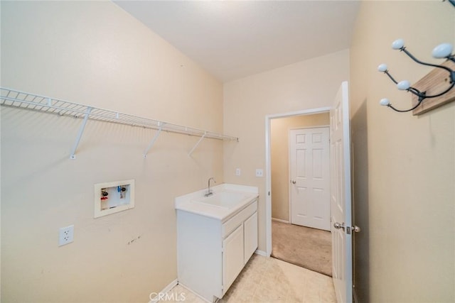 35317 Trevino Trl, Beaumont, CA 92223 - laundry room with baseboards, washer hookup, cabinet space, and a sink