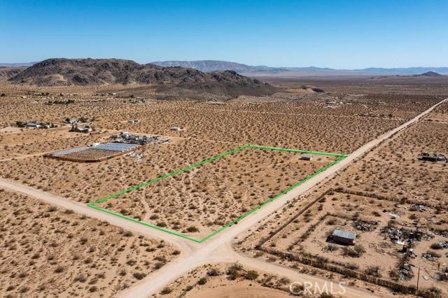 drone / aerial view with a desert view and a rural view