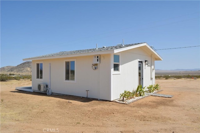 view of home's exterior with a mountain view