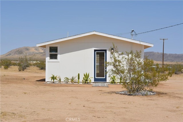 exterior space featuring a mountain view