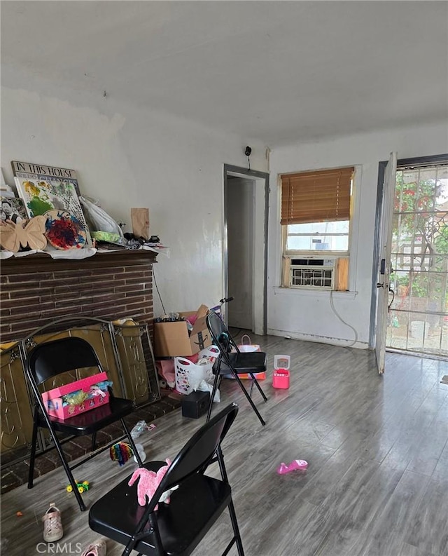 interior space with cooling unit and wood finished floors