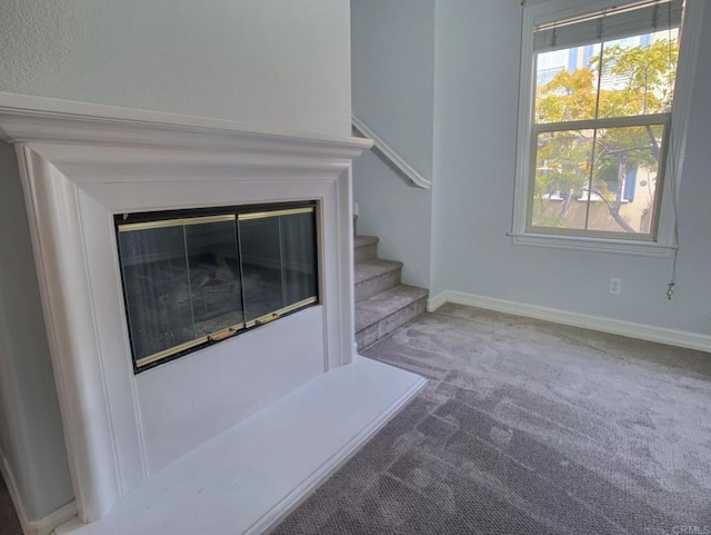 2668 Escala Cir, San Diego, CA 92108 - unfurnished living room featuring stairway, baseboards, and carpet floors