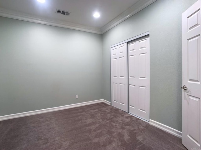 2668 Escala Cir, San Diego, CA 92108 - interior space with a closet, dark colored carpet, baseboards, visible vents, and crown molding