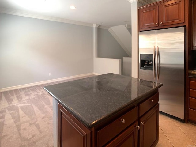 2668 Escala Cir, San Diego, CA 92108 - kitchen featuring dark stone countertops, ornamental molding, stainless steel fridge, and a center island