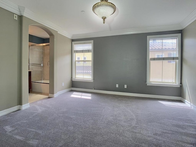 2668 Escala Cir, San Diego, CA 92108 - carpeted empty room with baseboards, arched walkways, a healthy amount of sunlight, and crown molding