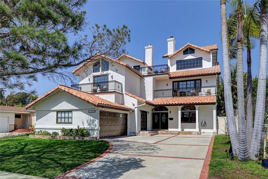 13001 Warren Ave, Los Angeles, CA 90066 - mediterranean / spanish-style home featuring a tile roof, stucco siding, and a chimney