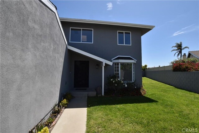 23408 Dorset Pl, Harbor City, CA 90710 - exterior space with stucco siding, fence, and a front yard