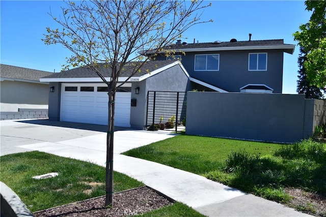 23408 Dorset Pl, Harbor City, CA 90710 - view of front of property with fence, driveway, a garage, and stucco siding