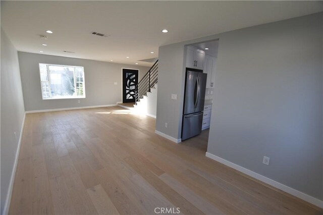 23408 Dorset Pl, Harbor City, CA 90710 - empty room featuring recessed lighting, stairway, visible vents, light wood-type flooring, and baseboards