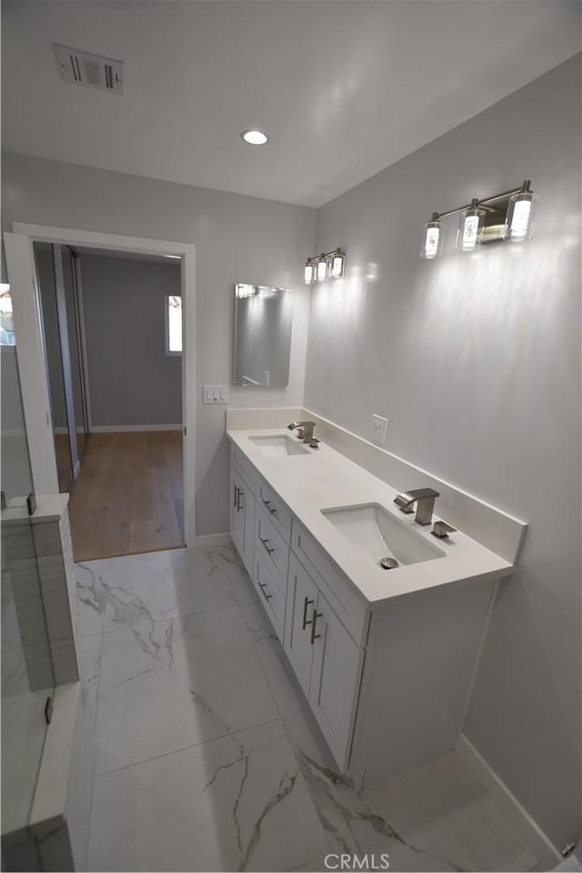 23408 Dorset Pl, Harbor City, CA 90710 - full bathroom featuring visible vents, baseboards, a sink, and marble finish floor
