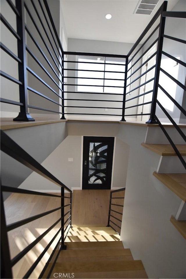 23408 Dorset Pl, Harbor City, CA 90710 - staircase with a towering ceiling, wood finished floors, visible vents, and recessed lighting