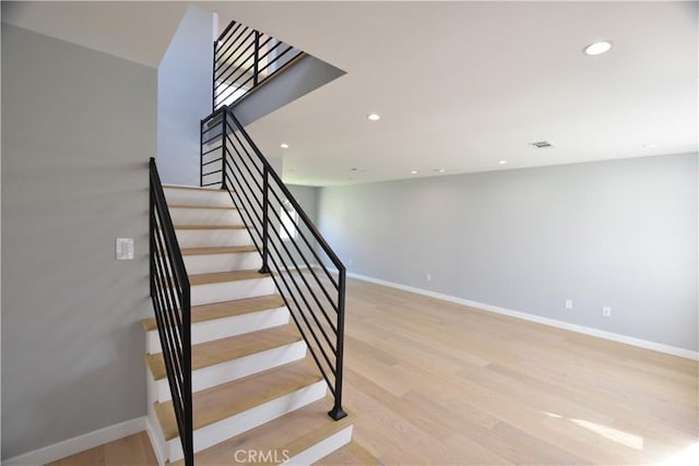 23408 Dorset Pl, Harbor City, CA 90710 - stairs featuring recessed lighting, wood finished floors, and baseboards