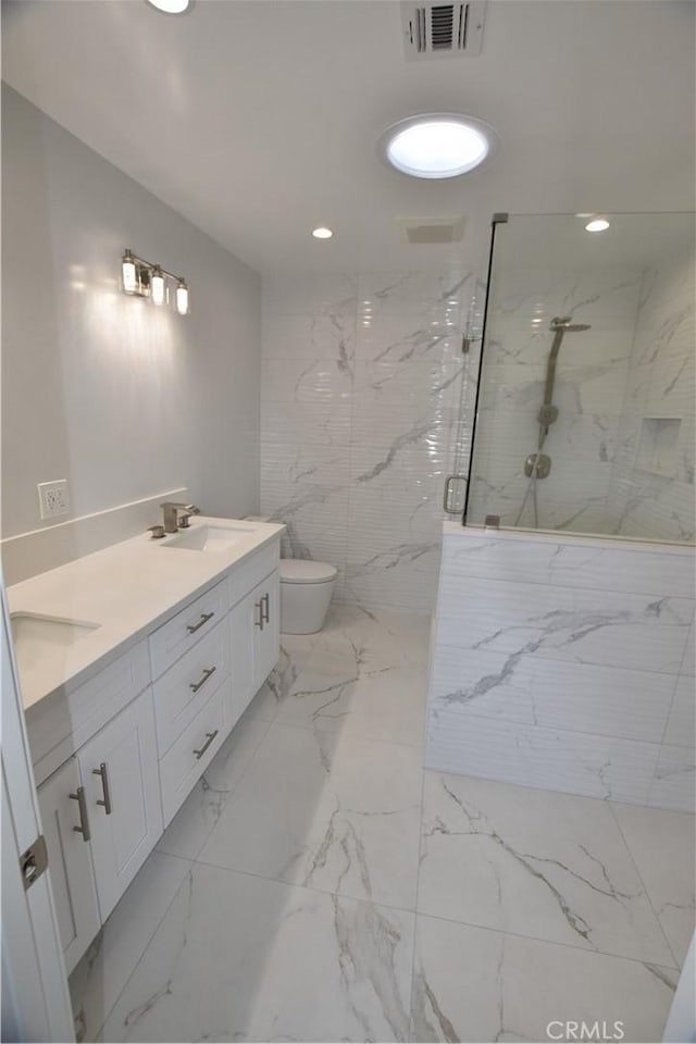 23408 Dorset Pl, Harbor City, CA 90710 - bathroom with a sink, a marble finish shower, marble finish floor, double vanity, and visible vents