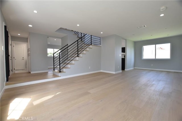 23408 Dorset Pl, Harbor City, CA 90710 - unfurnished living room featuring visible vents, baseboards, light wood-style floors, recessed lighting, and stairs