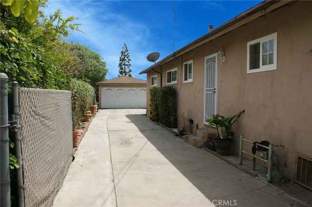 3724 W 105th St, Inglewood, CA 90303 - view of property exterior with stucco siding and a detached garage