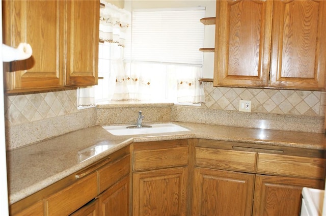 3724 W 105th St, Inglewood, CA 90303 - kitchen with backsplash, brown cabinets, open shelves, and light stone counters