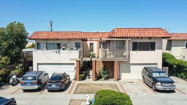 764 W 18th St, Costa Mesa, CA 92627 - view of front facade featuring an attached garage, stucco siding, concrete driveway, a balcony, and a tiled roof