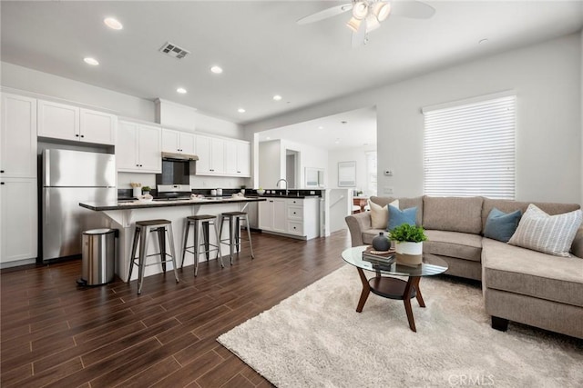 144 Borrego, Irvine, CA 92618 - living room with visible vents, recessed lighting, ceiling fan, and dark wood-type flooring