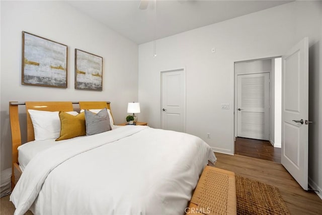 144 Borrego, Irvine, CA 92618 - bedroom featuring baseboards, wood finished floors, and ceiling fan