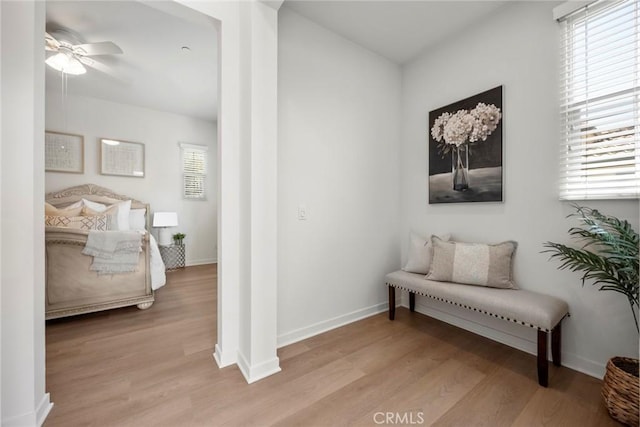 144 Borrego, Irvine, CA 92618 - sitting room with light wood finished floors, a wealth of natural light, ceiling fan, and baseboards