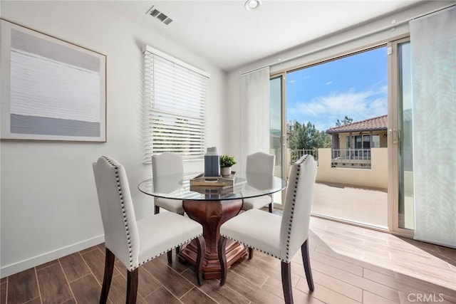 144 Borrego, Irvine, CA 92618 - dining area with baseboards, visible vents, a wealth of natural light, and wood tiled floor