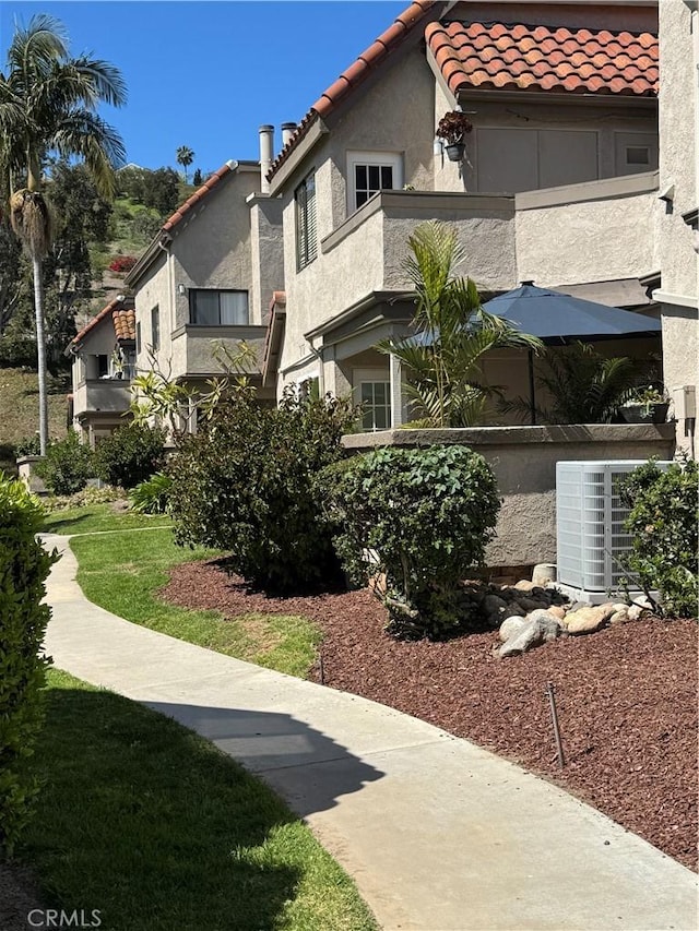 exterior space featuring central air condition unit