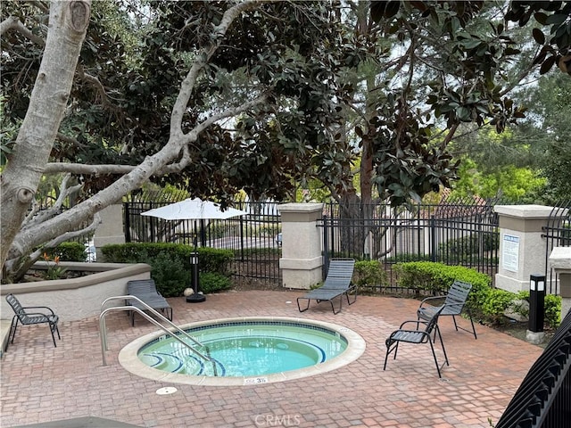 28181 Sorrento Unit 97, Laguna Niguel, CA 92677 - view of swimming pool with a community hot tub, fence, and a patio area
